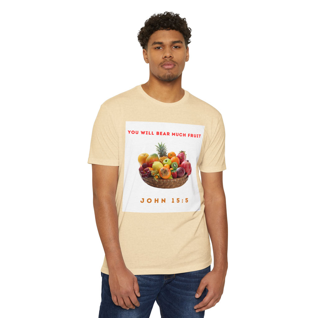 Man wearing a beige t-shirt with a graphic of fruits and text on a white background